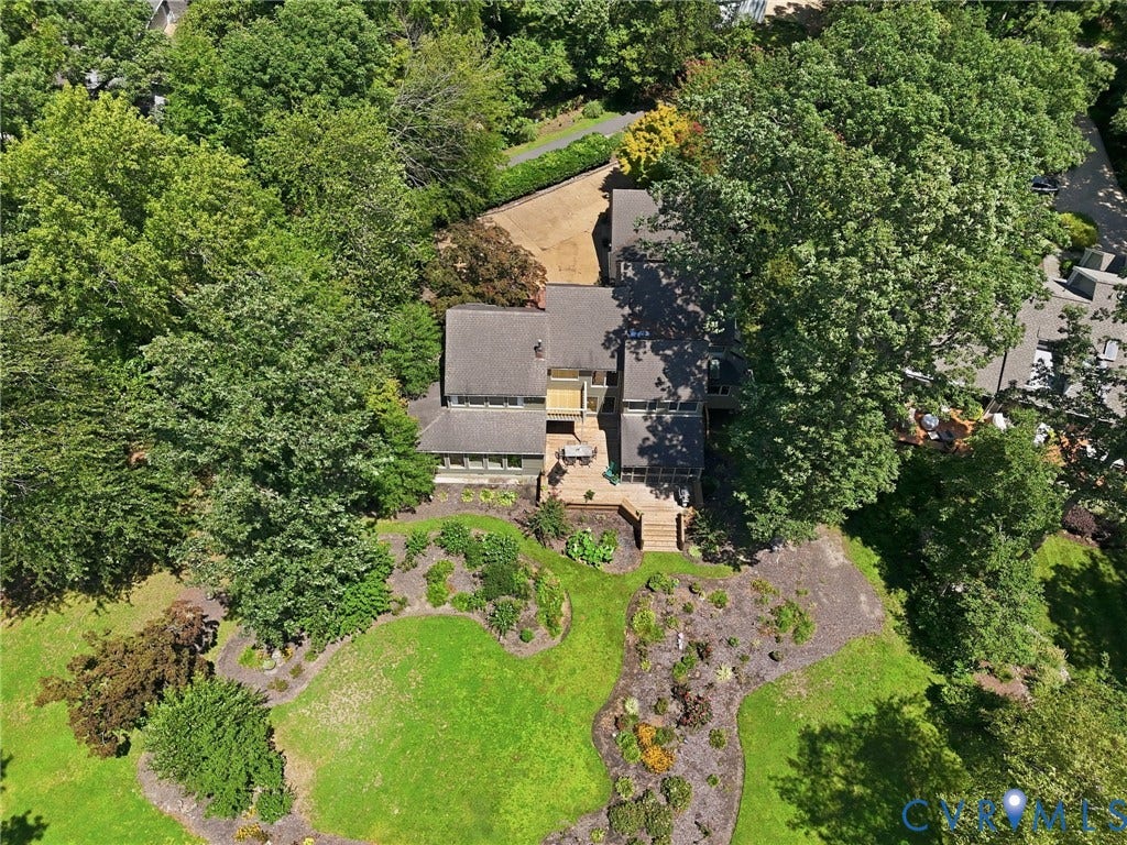 3416 Walkers Ferry Road, Walkers Ferry, Midlothian, VA 23112 Expansive property featuring a multi-level structure with a dark-toned roof, a large outdoor patio, and a gravel driveway