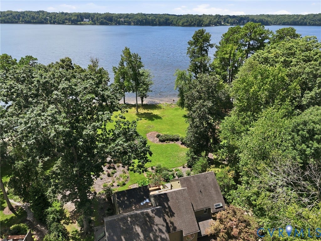3416 Walkers Ferry Road, Walkers Ferry, Midlothian, VA 23112 Expansive waterfront property with direct lake access, a large lawn area, and mature trees