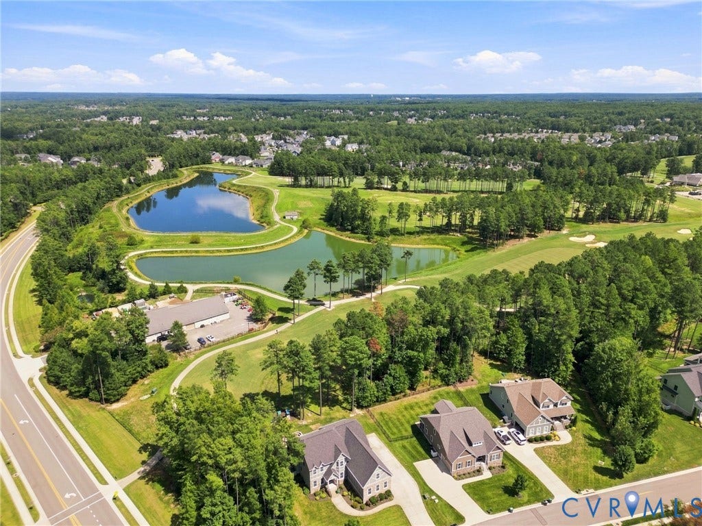 6907 Carden Park Drive, Carden Park, Moseley, VA 23120 Expansive golf course setting featuring multiple greens, tree-lined fairways, and multiple water features