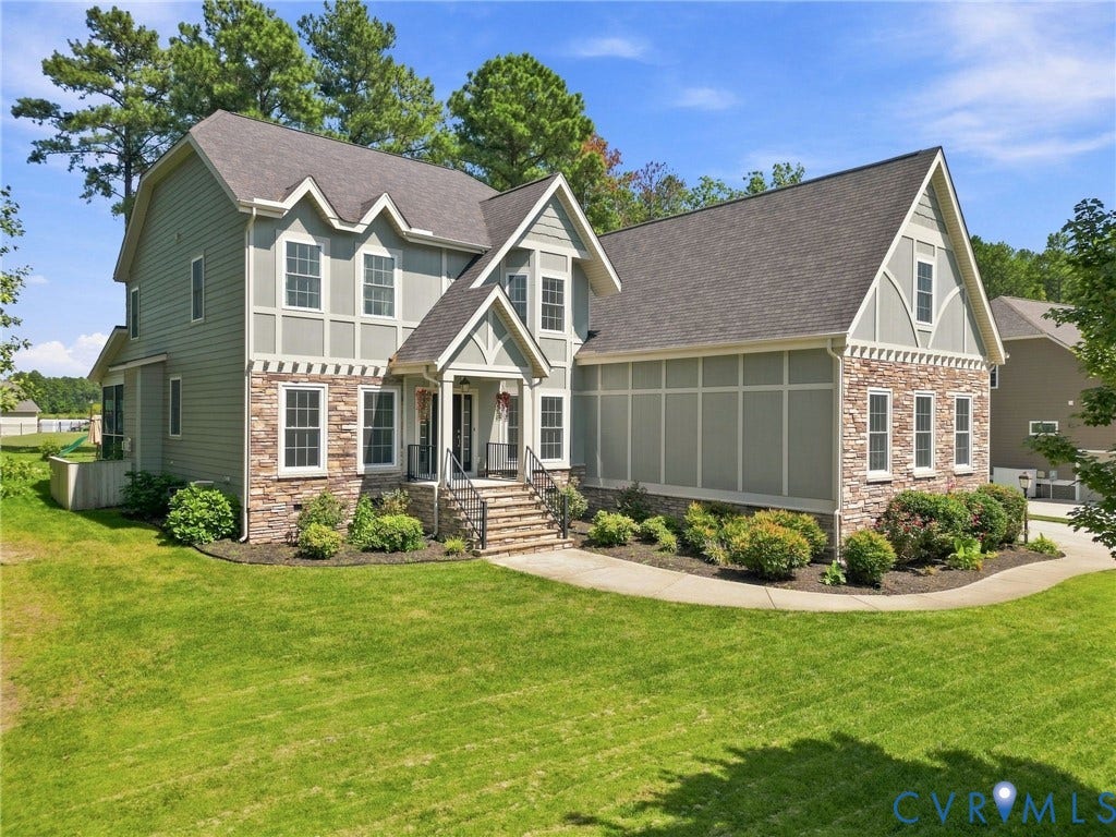 6907 Carden Park Drive, Carden Park, Moseley, VA 23120 Two-story residence featuring a stone and siding exterior, multiple gables, and a prominent front entrance with stairs