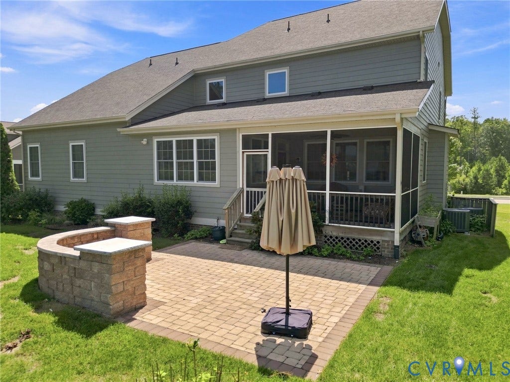 6907 Carden Park Drive, Carden Park, Moseley, VA 23120 Paver patio with a built-in stone wall, a screened porch, and a light-colored siding exterior