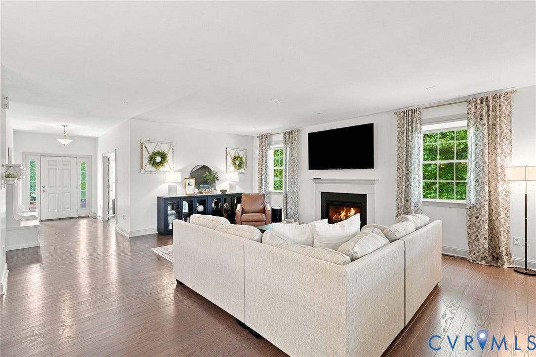 6907 Carden Park Drive, Carden Park, Moseley, VA 23120 Hardwood flooring throughout, and a fireplace with a white mantel and dark hearth