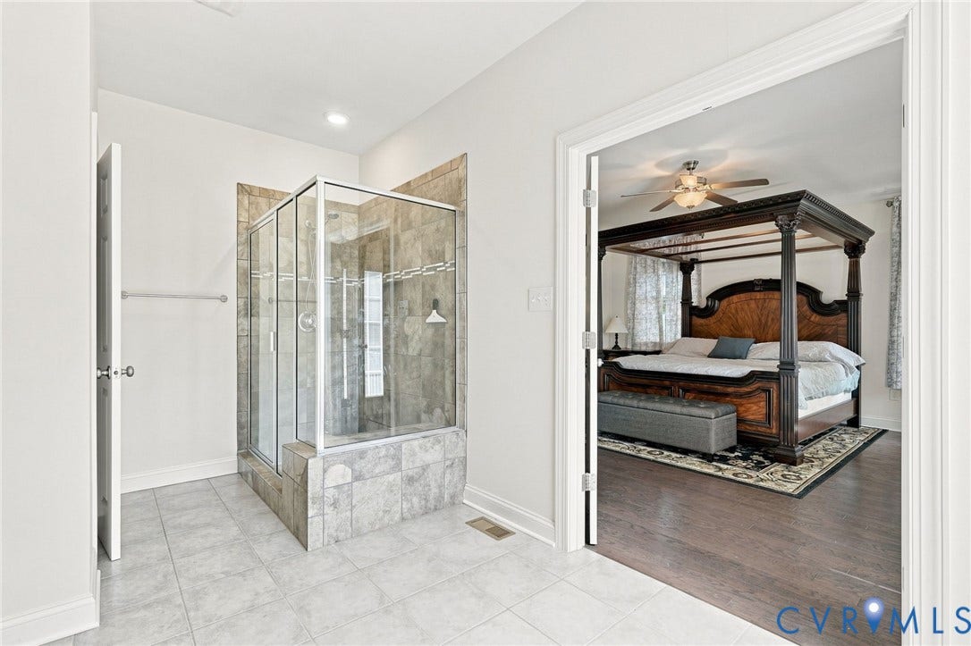 6907 Carden Park Drive, Carden Park, Moseley, VA 23120 Glass-enclosed shower with tiled walls and a tiled base