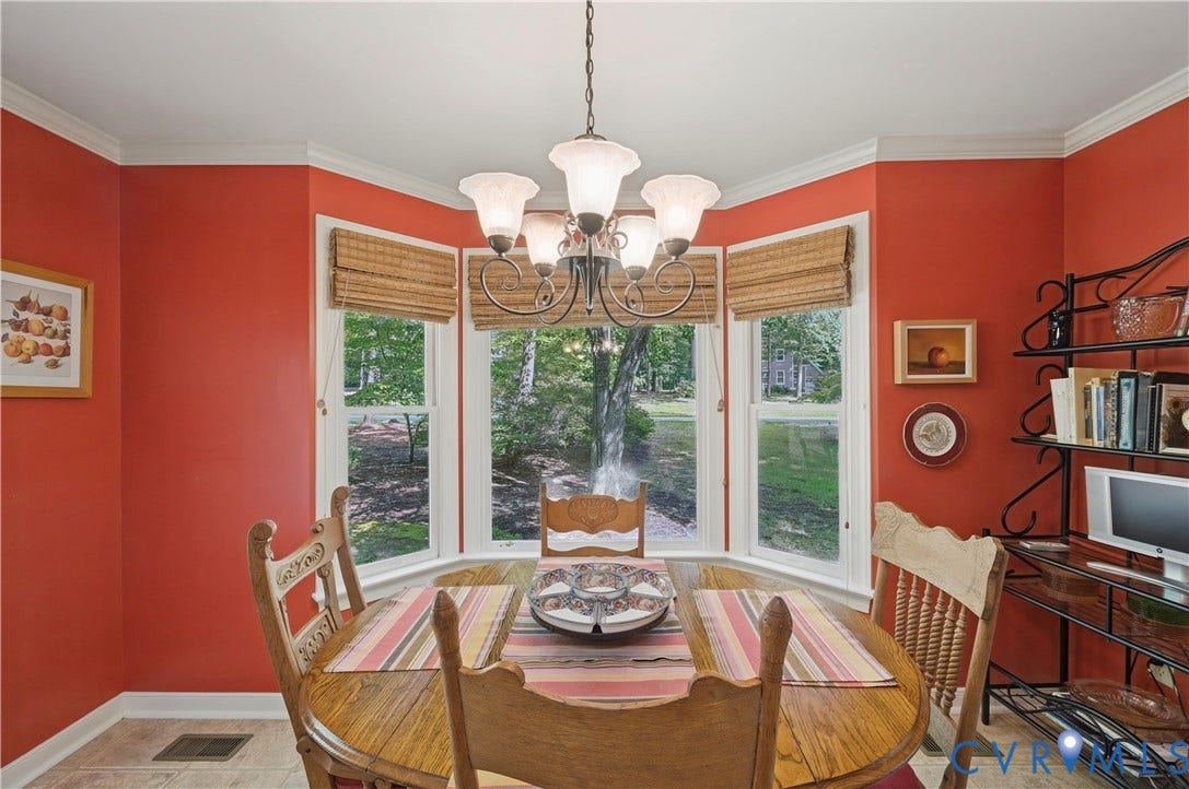 411 Hickory Drive, Manakin Sabot, VA 23103 Bay window with natural light, tiled flooring, built-in shelving, crown molding, and a chandelier
