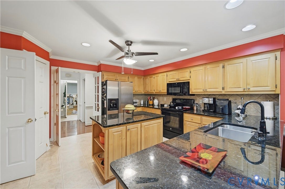 411 Hickory Drive, Manakin Sabot, VA 23103 Kitchen featuring a central island, recessed lighting, ceiling fan, wood-finish cabinetry, and dark stone countertops