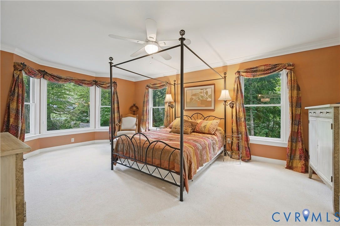 411 Hickory Drive, Manakin Sabot, VA 23103 Bay window, crown molding, white ceiling fan with integrated lighting, carpeted flooring, and neutral wall paint
