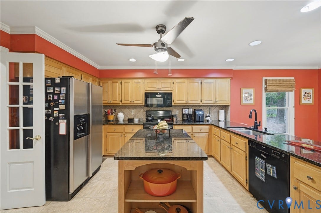 411 Hickory Drive, Manakin Sabot, VA 23103 Kitchen featuring a central island with countertop, tile flooring, and wood-finish cabinetry