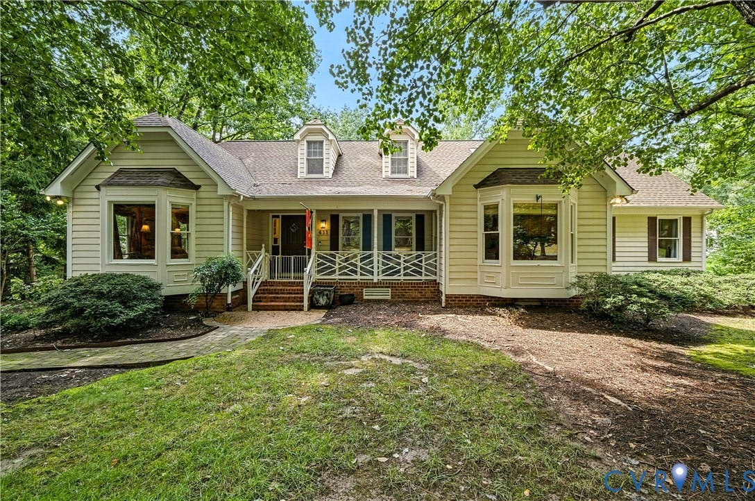 411 Hickory Drive, Manakin Sabot, VA 23103 Traditional-style home featuring a covered front porch, dormer windows, and bay windows