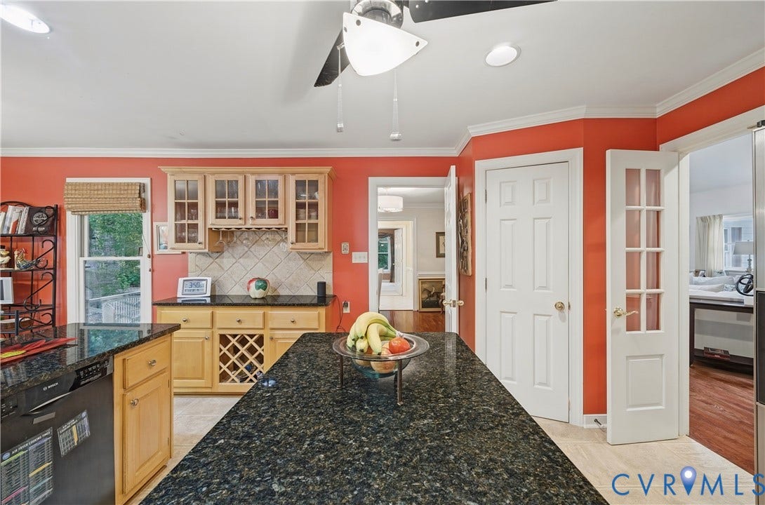 411 Hickory Drive, Manakin Sabot, VA 23103 Kitchen featuring granite countertops, wood cabinetry with glass-front uppers, a built-in wine rack, tile flooring, and a ceiling fan