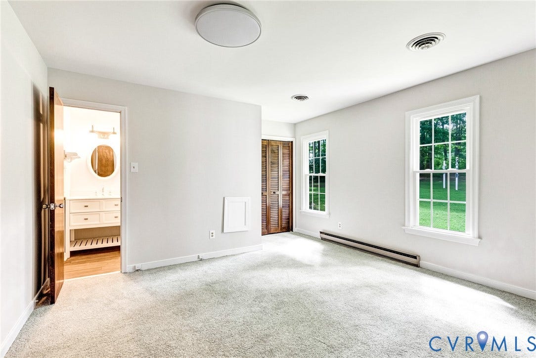 10478 Gould Hill Road, Studley, Hanover, VA 23069 First floor primary bedroom. Two closets. Freshly painted. New carpet and new light fixture. Attached primary bath