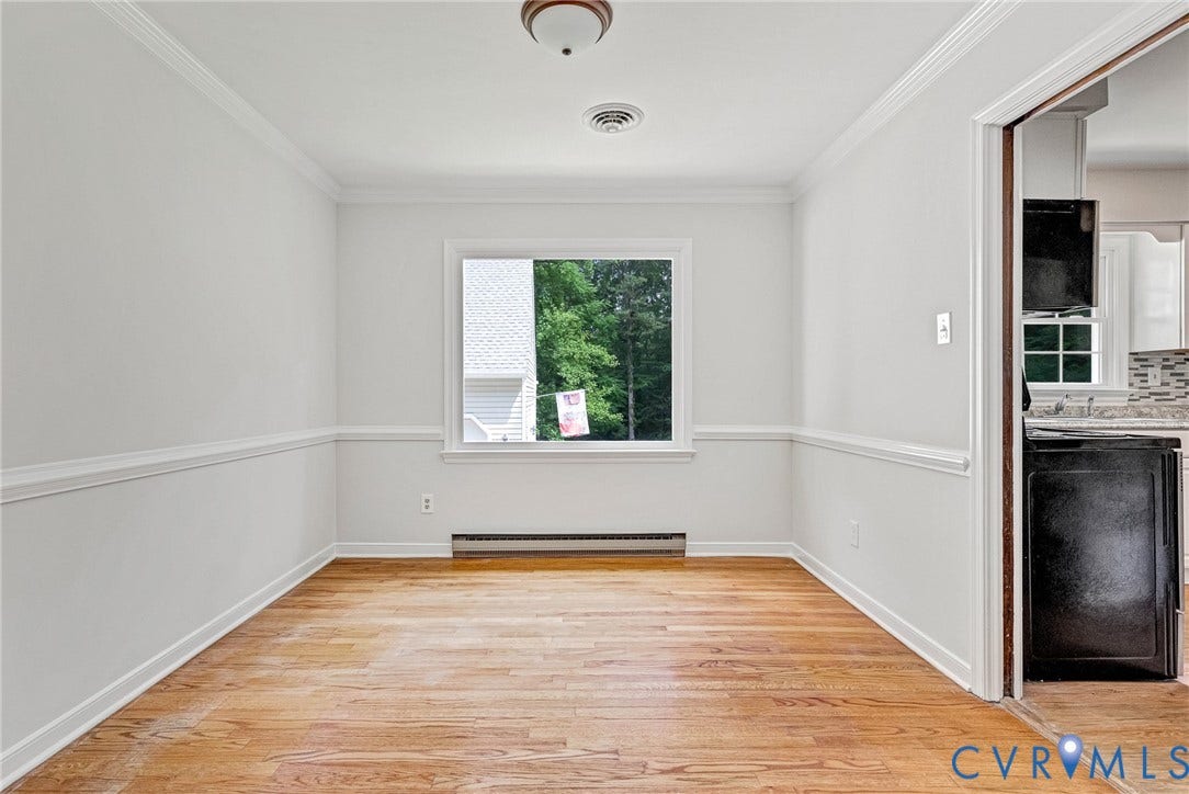 10478 Gould Hill Road, Studley, Hanover, VA 23069 Dining room located off the kitchen. Freshly painted. New light fixture. Chair rail and crown molding. View of private backyard