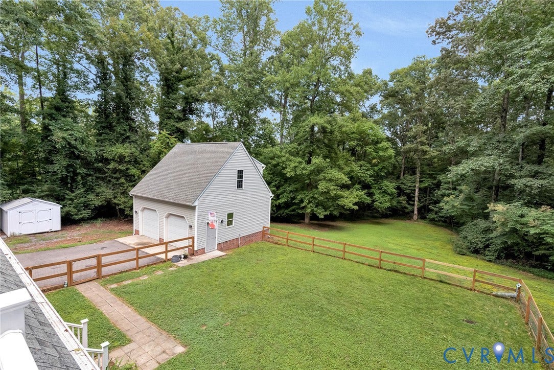 10478 Gould Hill Road, Studley, Hanover, VA 23069 View from balcony. Spacious and private fenced backyard. Surrounded by mature trees. View of garage and shed