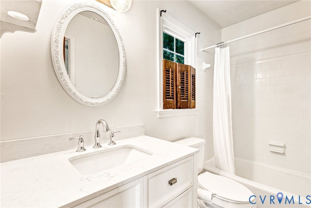 10478 Gould Hill Road, Studley, Hanover, VA 23069 First floor primary bath. Freshly painted. Newer White vanity with integrated sink, polished chrome faucet, and white countertop