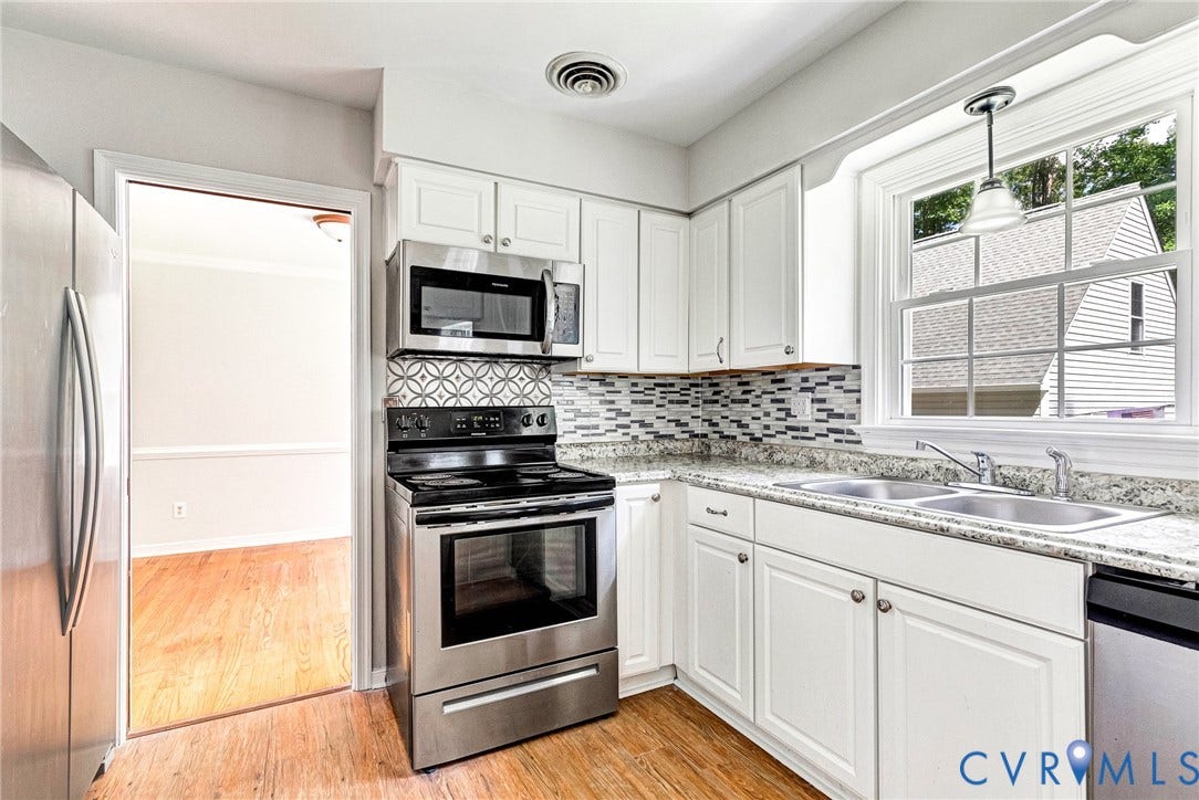 10478 Gould Hill Road, Studley, Hanover, VA 23069 Kitchen featuring white cabinetry, stainless steel appliances, a dual basin sink, and wood-finish flooring