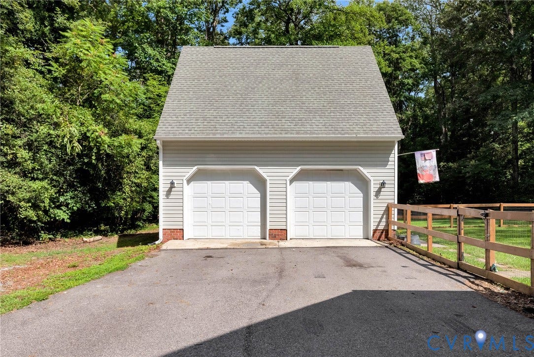 10478 Gould Hill Road, Studley, Hanover, VA 23069 Detached structure featuring two garage bays, light-toned siding, and a gabled roof