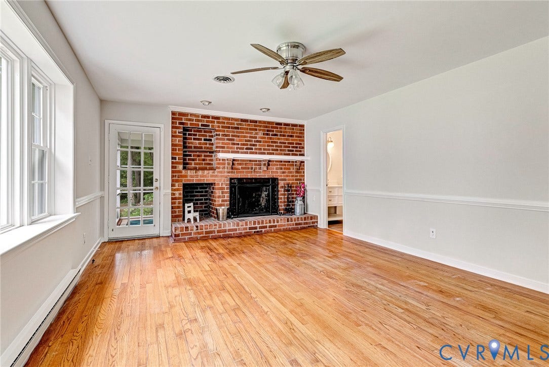 10478 Gould Hill Road, Studley, Hanover, VA 23069 Large great room, freshly painted. Includes brick wood burning fireplace. Door on left leads to screened porch. Door on right leads to primary bath.
