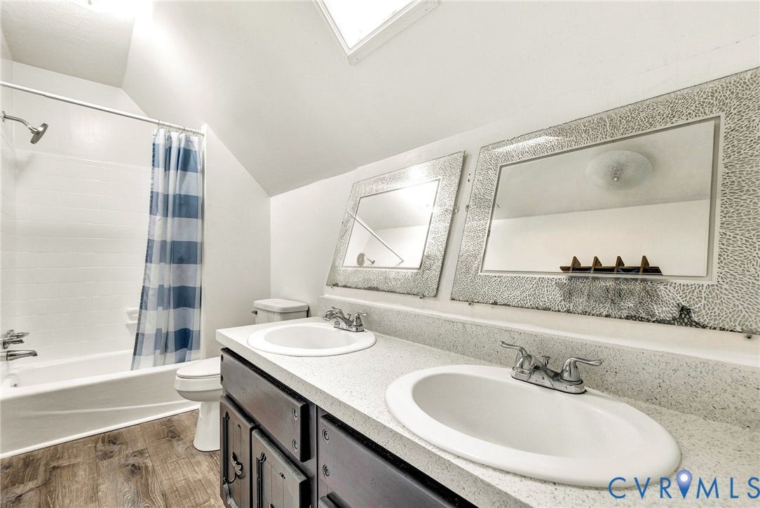 10478 Gould Hill Road, Studley, Hanover, VA 23069 Another view of bathroom. Dual vanity with integral sinks, gray wood-finish cabinetry, and framed mirrors. Fresh paint