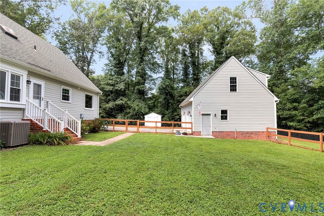 10478 Gould Hill Road, Studley, Hanover, VA 23069 Expansive lawn area with a detached structure featuring garage doors and a separate entrance