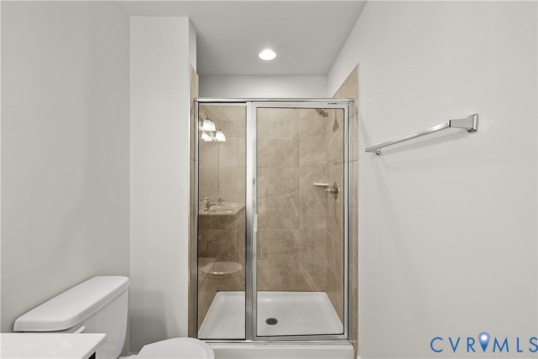 3372 Dewsberry Lane, Henrico, VA 23231 Glass-enclosed shower with a tiled surround and a white shower pan