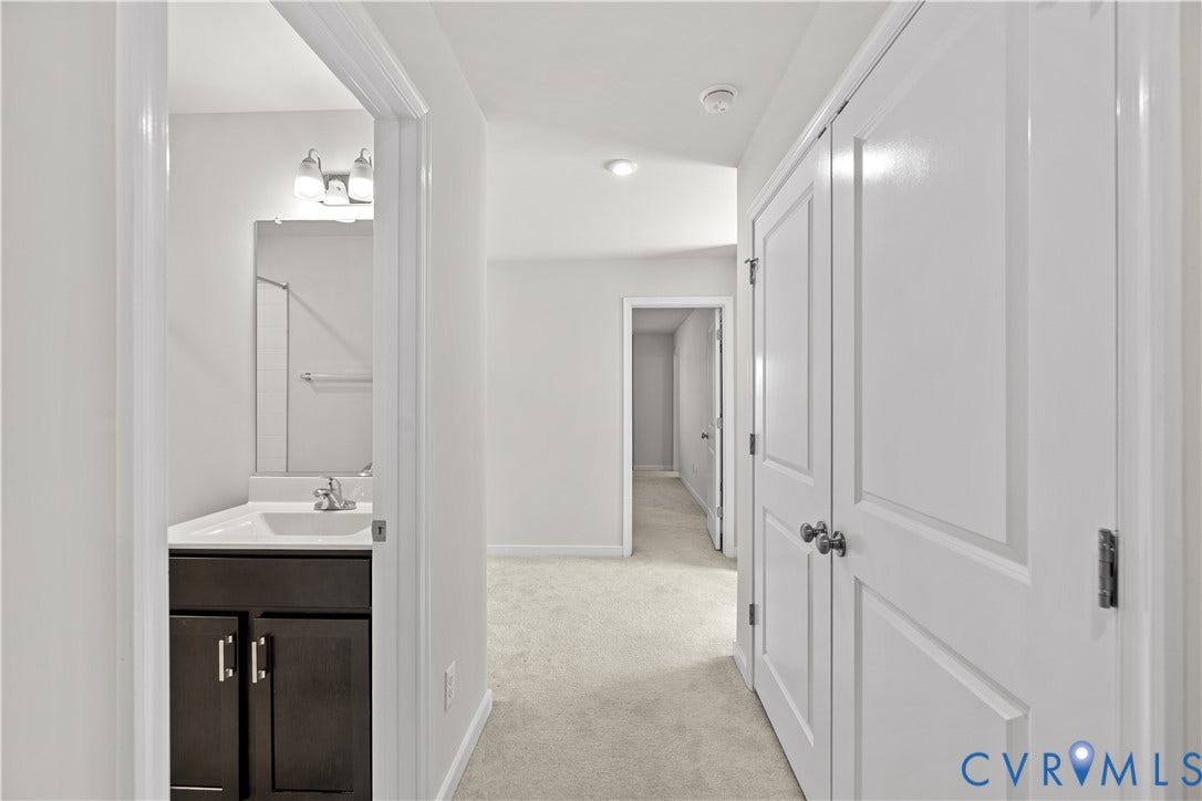 3372 Dewsberry Lane, Henrico, VA 23231 Hallway featuring neutral carpet, white paneled doors, and recessed lighting