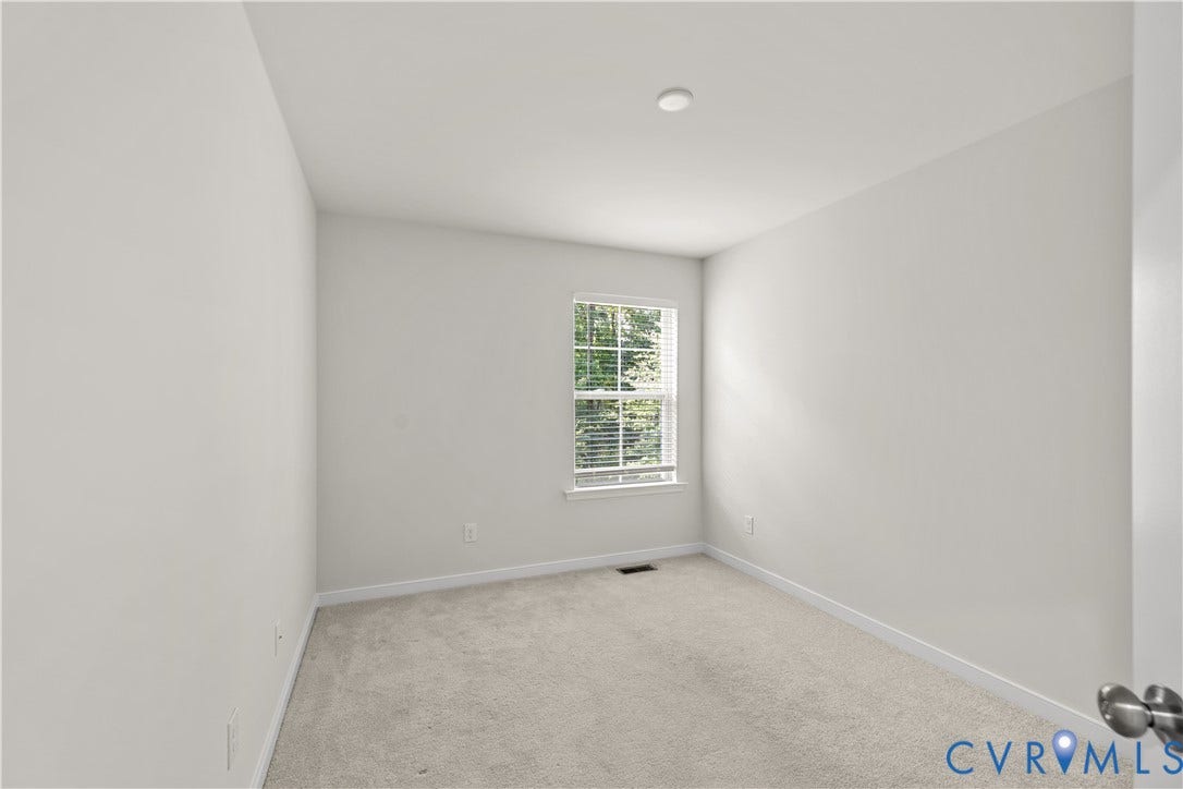 3372 Dewsberry Lane, Henrico, VA 23231 Neutral wall paint, carpet flooring, a single window with blinds, and recessed ceiling lighting