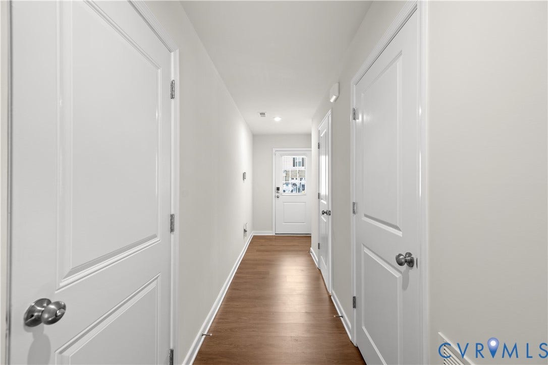 3372 Dewsberry Lane, Henrico, VA 23231 Hallway with wood-finish flooring, white walls, recessed lighting, and white interior doors with satin nickel hardware