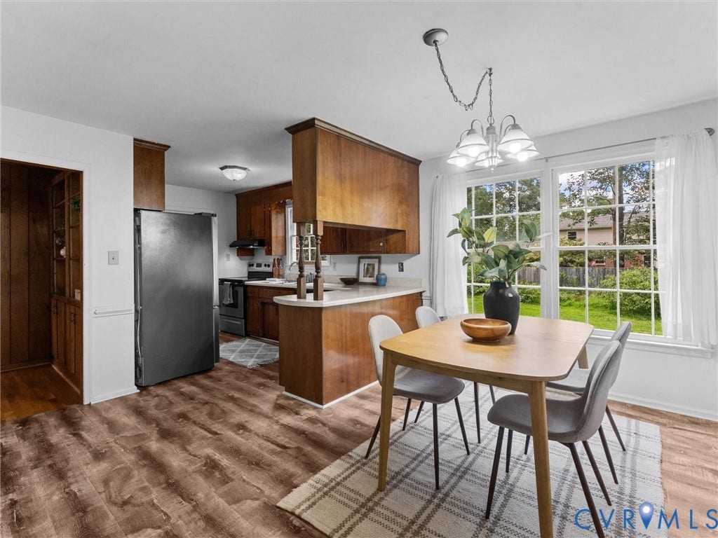 3610 Castlebury Drive, Chester, VA 23831 Wood-finish flooring throughout, kitchen with wood cabinetry, stainless steel refrigerator, and recessed lighting