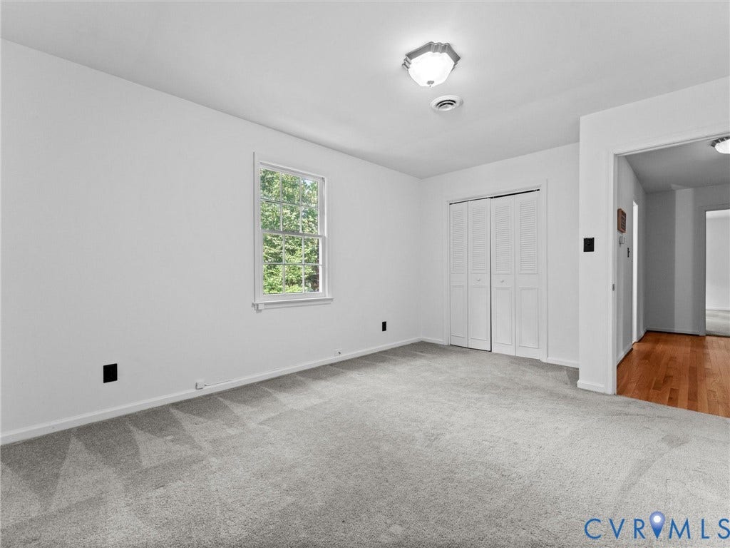 3610 Castlebury Drive, Chester, VA 23831 Light gray carpeting, white walls, and a large window with exterior greenery