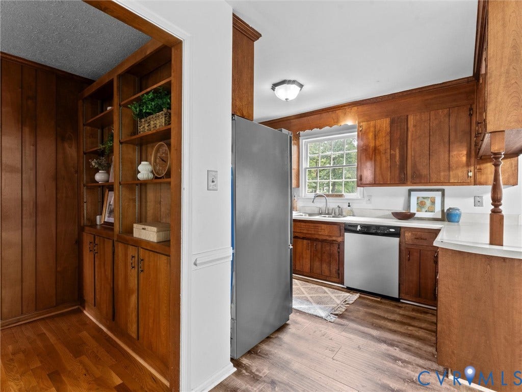 3610 Castlebury Drive, Chester, VA 23831 Kitchen featuring wood cabinetry, white countertops, stainless steel refrigerator, stainless steel dishwasher, and wood-finish flooring
