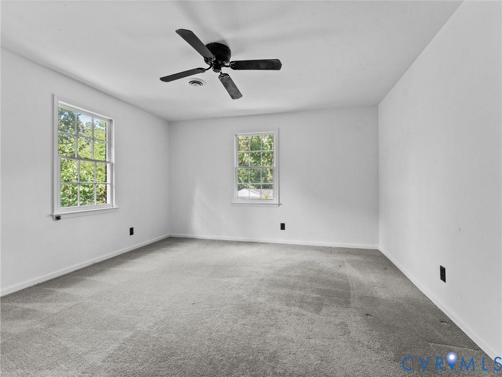 3610 Castlebury Drive, Chester, VA 23831 White interior walls, two double-hung windows, a ceiling fan, and carpeted flooring
