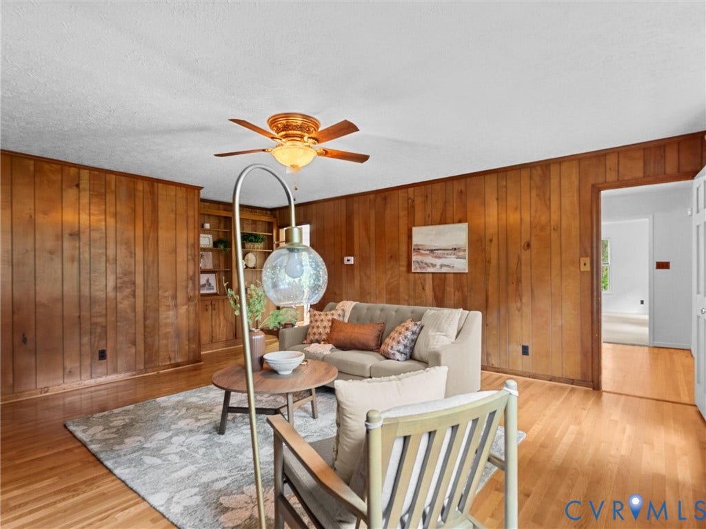 3610 Castlebury Drive, Chester, VA 23831 Wood-paneled walls and wood-finish flooring with a ceiling fan