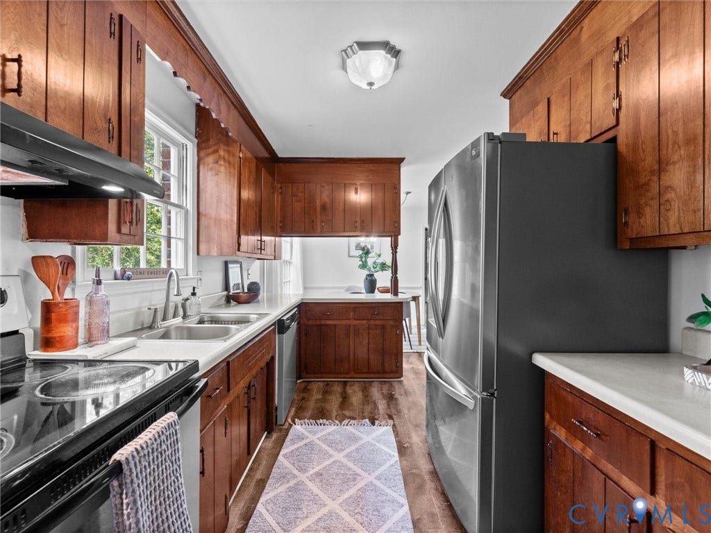 3610 Castlebury Drive, Chester, VA 23831 Wood-finish cabinetry paired with light countertops