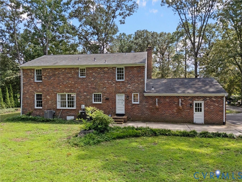 3610 Castlebury Drive, Chester, VA 23831 Brick exterior featuring multiple windows and a rear entry