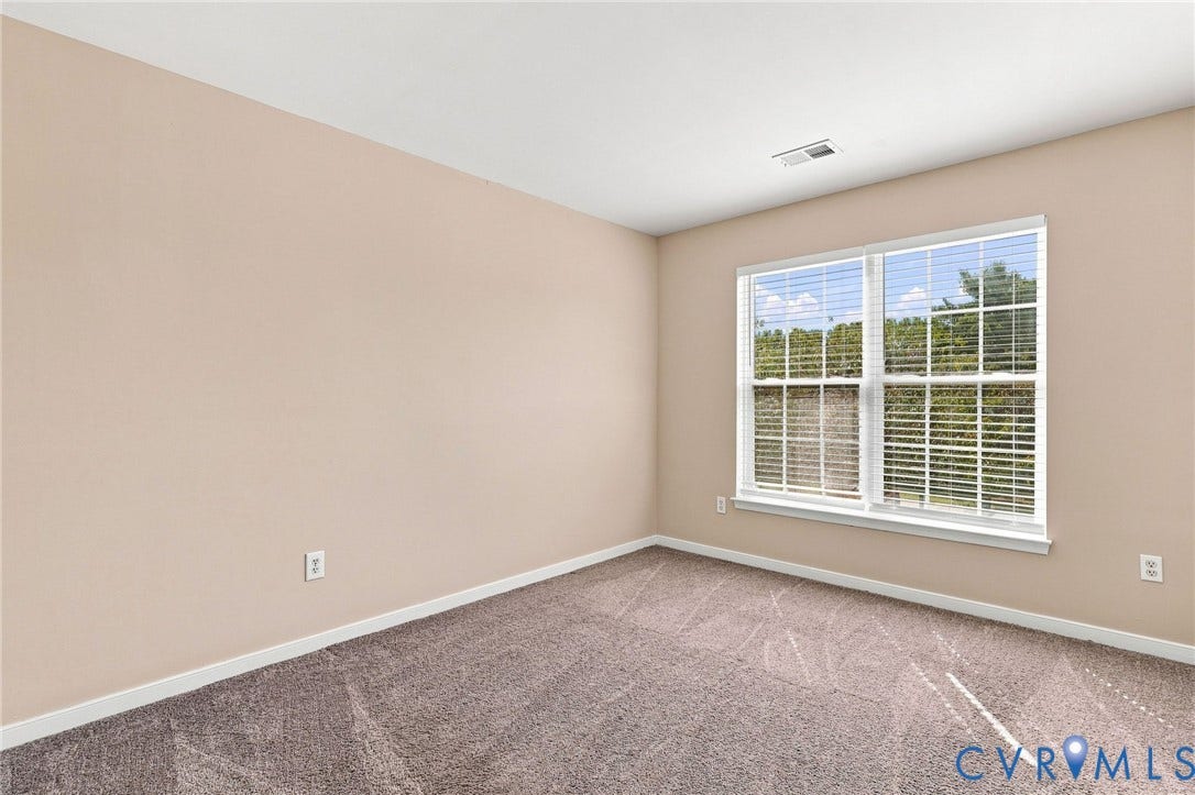 3818 Dominion Townes Circle, Dominion Townes, Richmond, VA 23223 Wall-to-wall carpeting, neutral wall color, large closet and a large window with white blinds