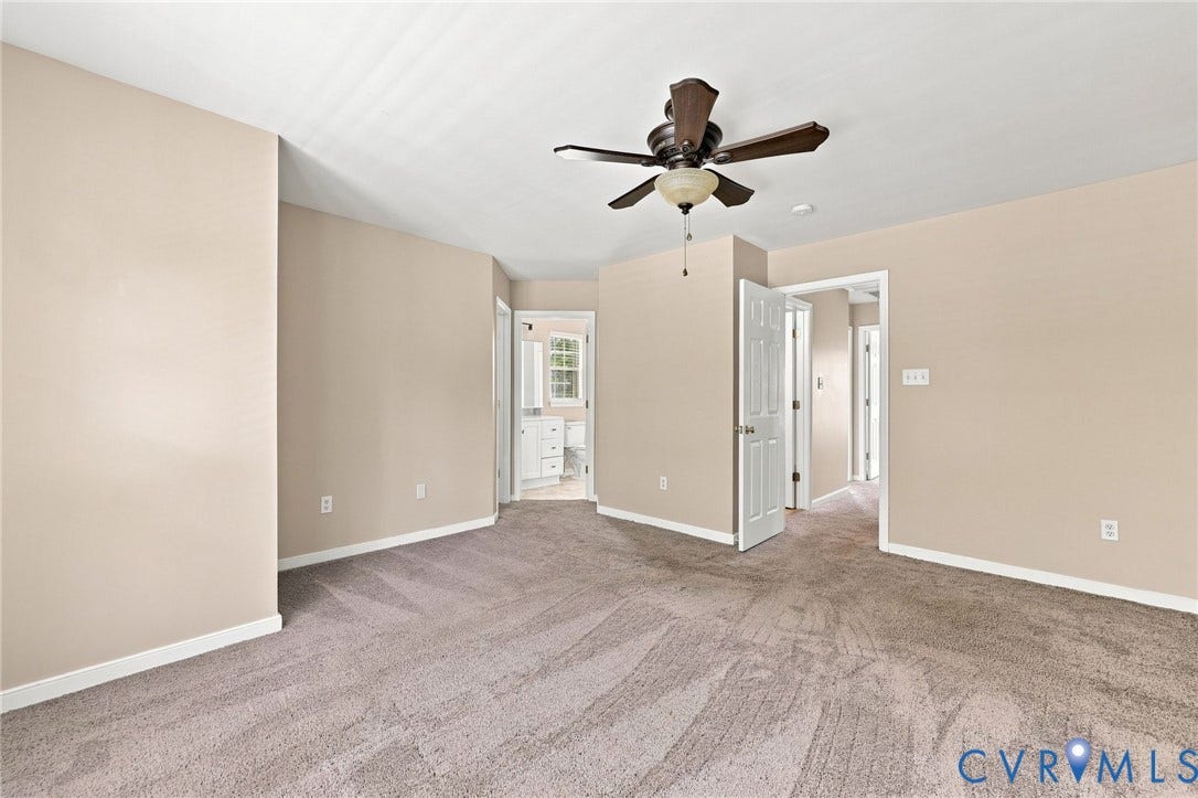 3818 Dominion Townes Circle, Dominion Townes, Richmond, VA 23223 Carpeted room with a ceiling fan, light neutral wall paint, and white trim