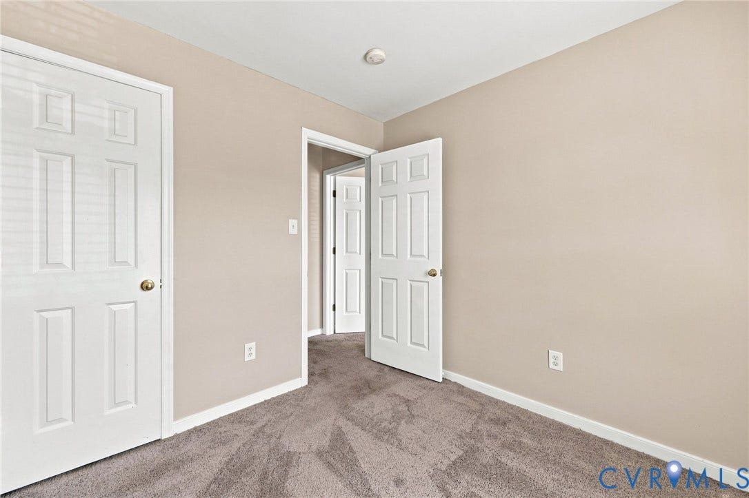 3818 Dominion Townes Circle, Dominion Townes, Richmond, VA 23223 Neutral-toned walls complement the gray patterned carpeting