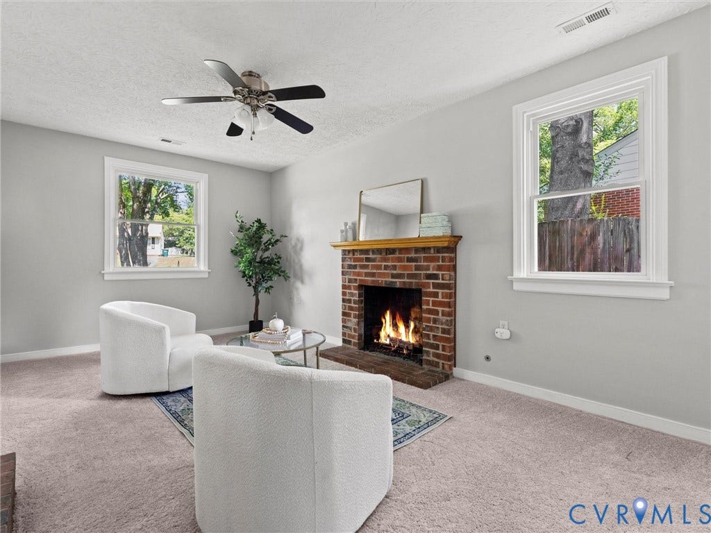 Sunken family room with brand new carpet and gas fireplace