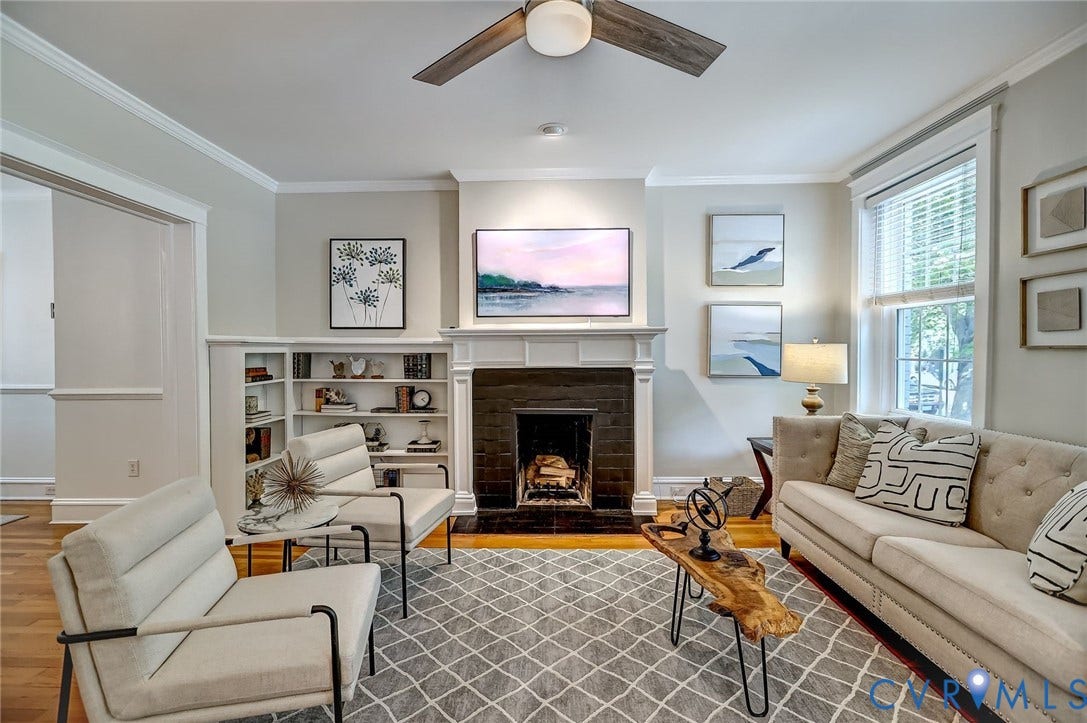 Fireplace with built-in bookshelf and wall-mounted 'art' TV