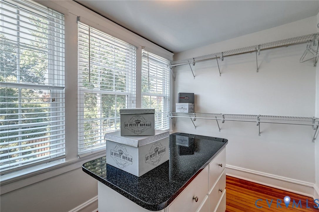 Bright walk-in-closet provides plenty of storage