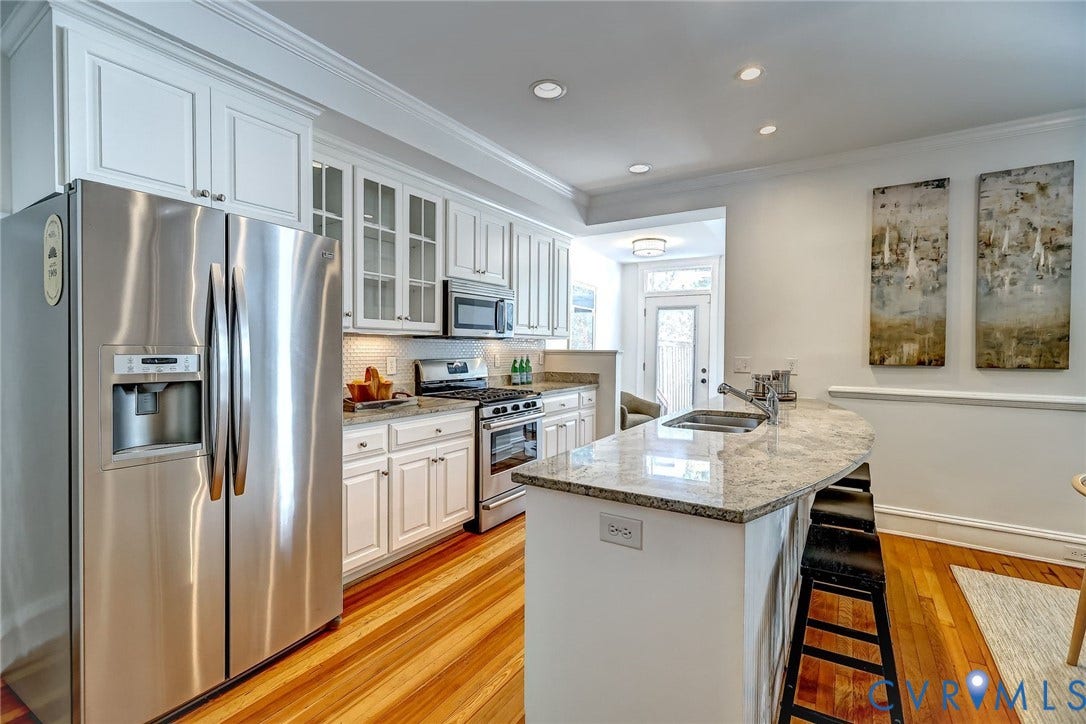 Chef's kitchen featuring stainless steel appliances and granite counters