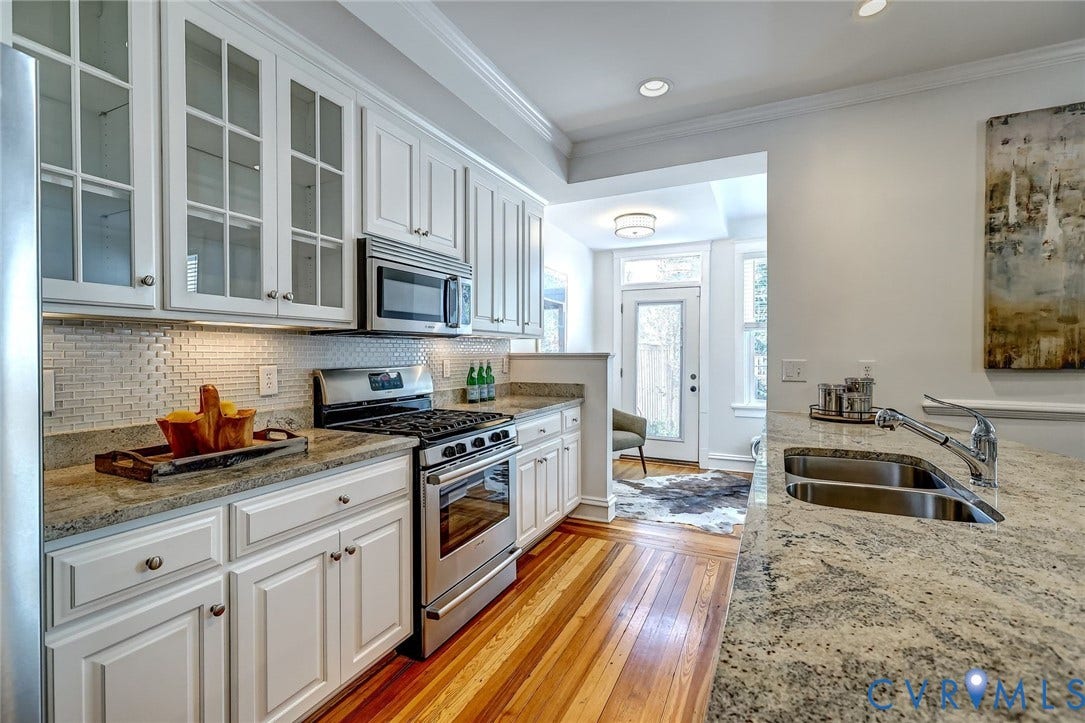 White cabinetry with glass-front doors
