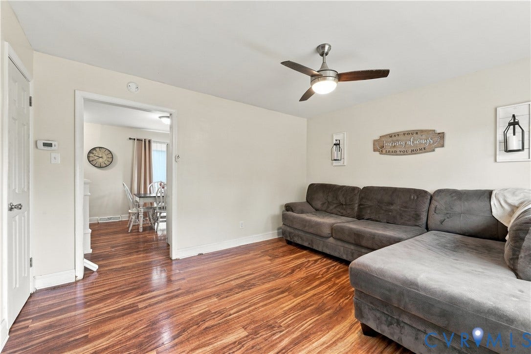 Wood-finish flooring throughout, complemented by light neutral wall tones