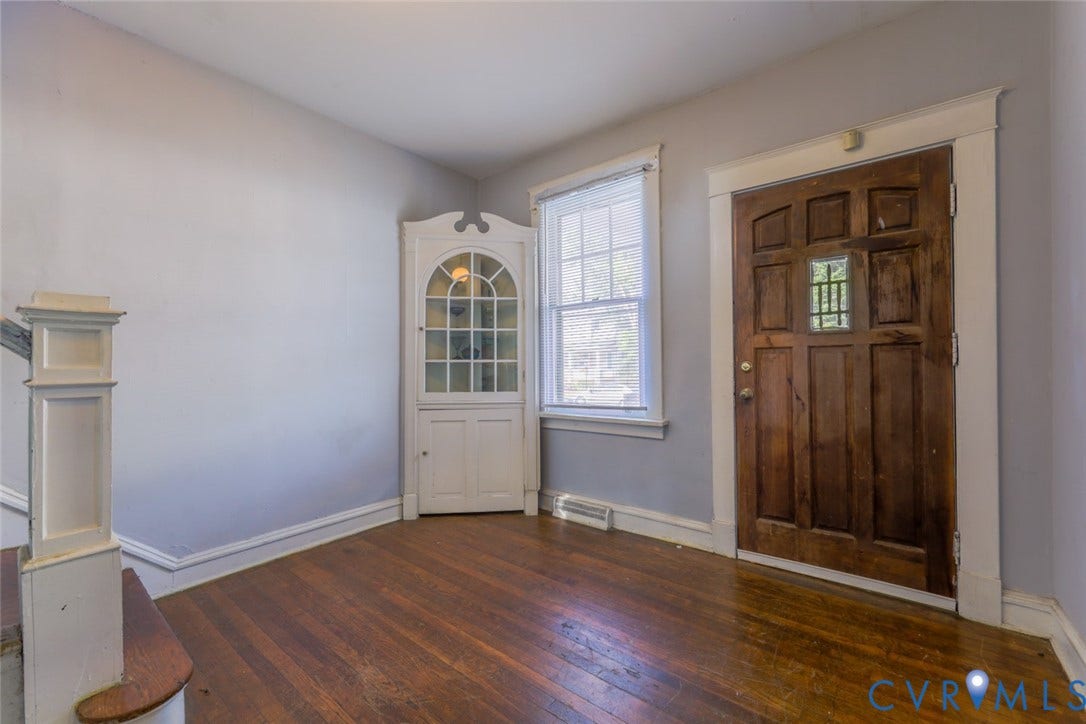 209 W 34th Street, Richmond, VA 23225 Rich wood-finish flooring with white trim and light gray walls