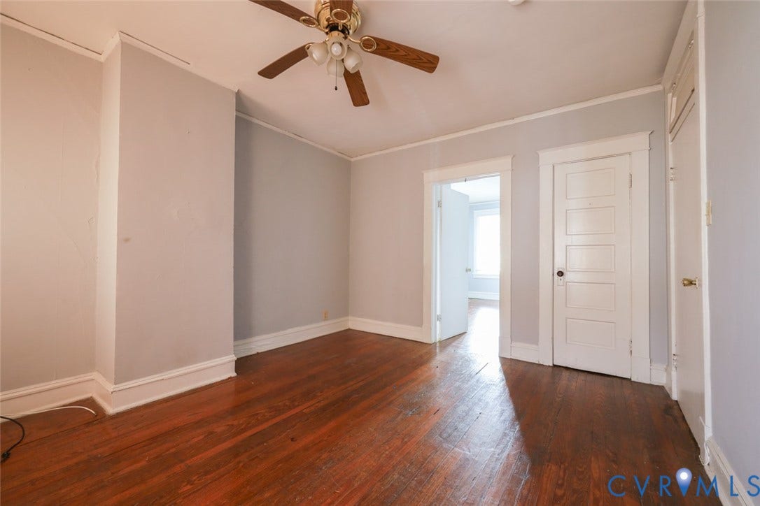 209 W 34th Street, Richmond, VA 23225 Wood-finish flooring, ceiling fan with light fixture, and white trim work
