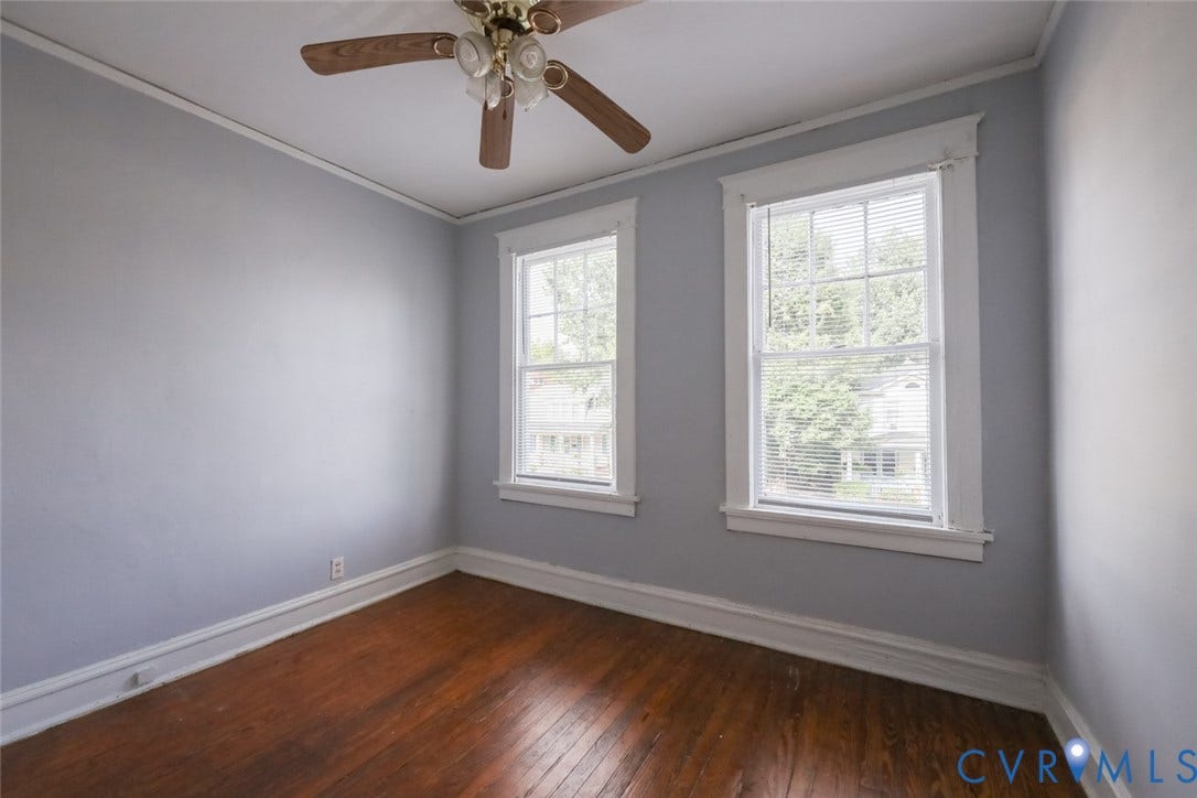209 W 34th Street, Richmond, VA 23225 Hardwood flooring, two double-hung windows, ceiling fan with light fixture, and crown molding