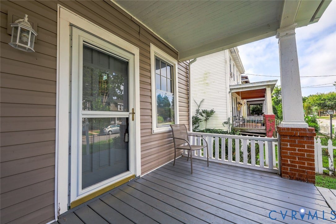 209 W 34th Street, Richmond, VA 23225 Front porch with horizontal siding, white trim, and a screen door