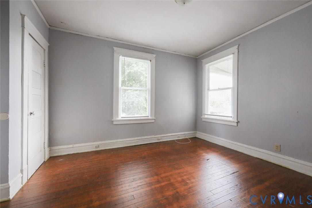 209 W 34th Street, Richmond, VA 23225 Hardwood flooring and two windows with white trim
