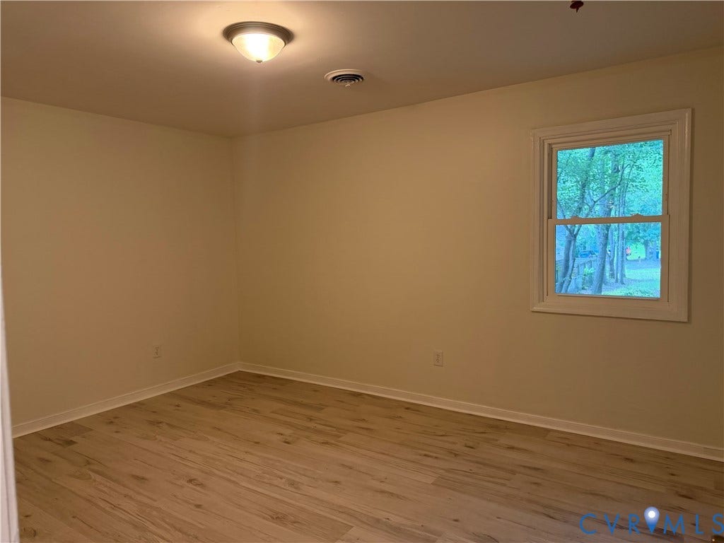 4706 Glen Tara Drive, Midlothian, VA 23112 Neutral wall color, wood-finish flooring, single window, flush-mount ceiling light