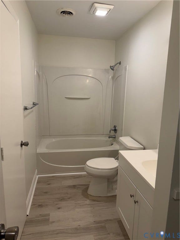 4706 Glen Tara Drive, Midlothian, VA 23112 White-paneled bathtub and shower combination, with a white toilet, and a white vanity with an integrated sink