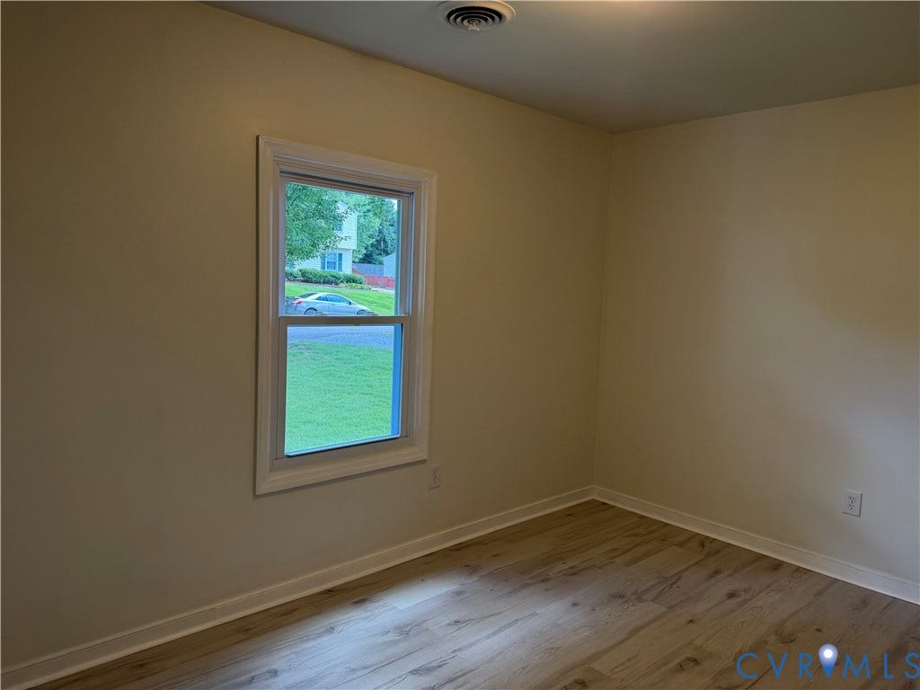 4706 Glen Tara Drive, Midlothian, VA 23112 Hardwood-finish flooring, single window with white trim, light-colored walls, and a ceiling light fixture